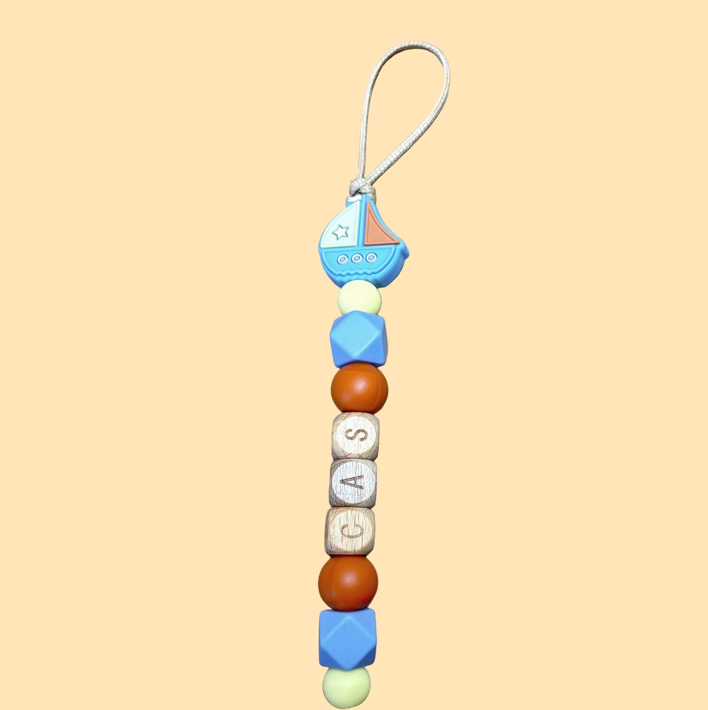 Speenkoord met naam - Cas - babyblauw/pastelgeel